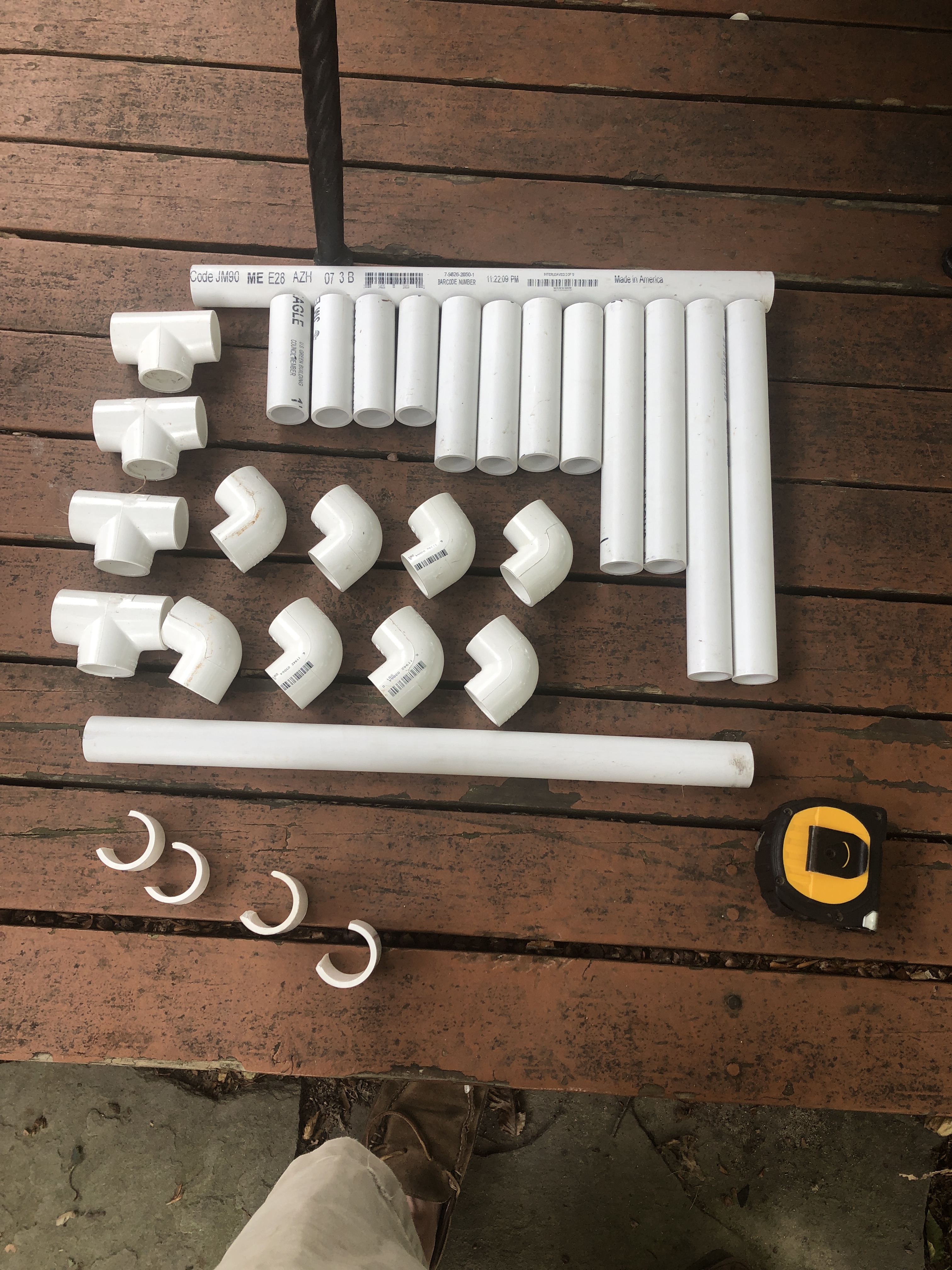 Cut pieces of PVC pipe and fittings ready for assembly